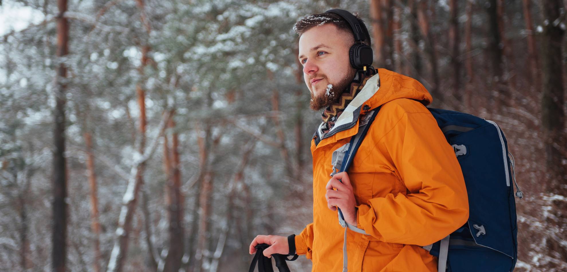 man with headphones at ski location